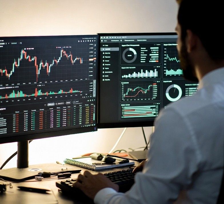 analyzing both crypto charts and supply chain dashboards